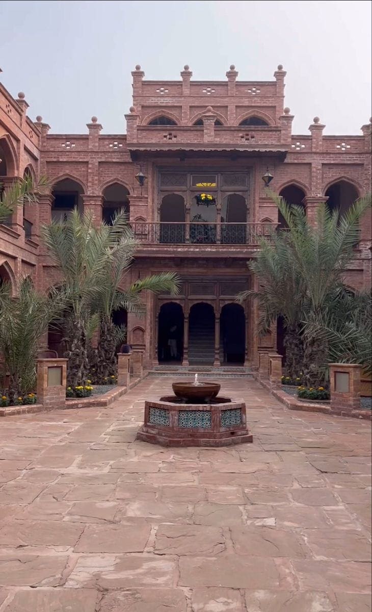 Courtyard fountain and carved doorway detail